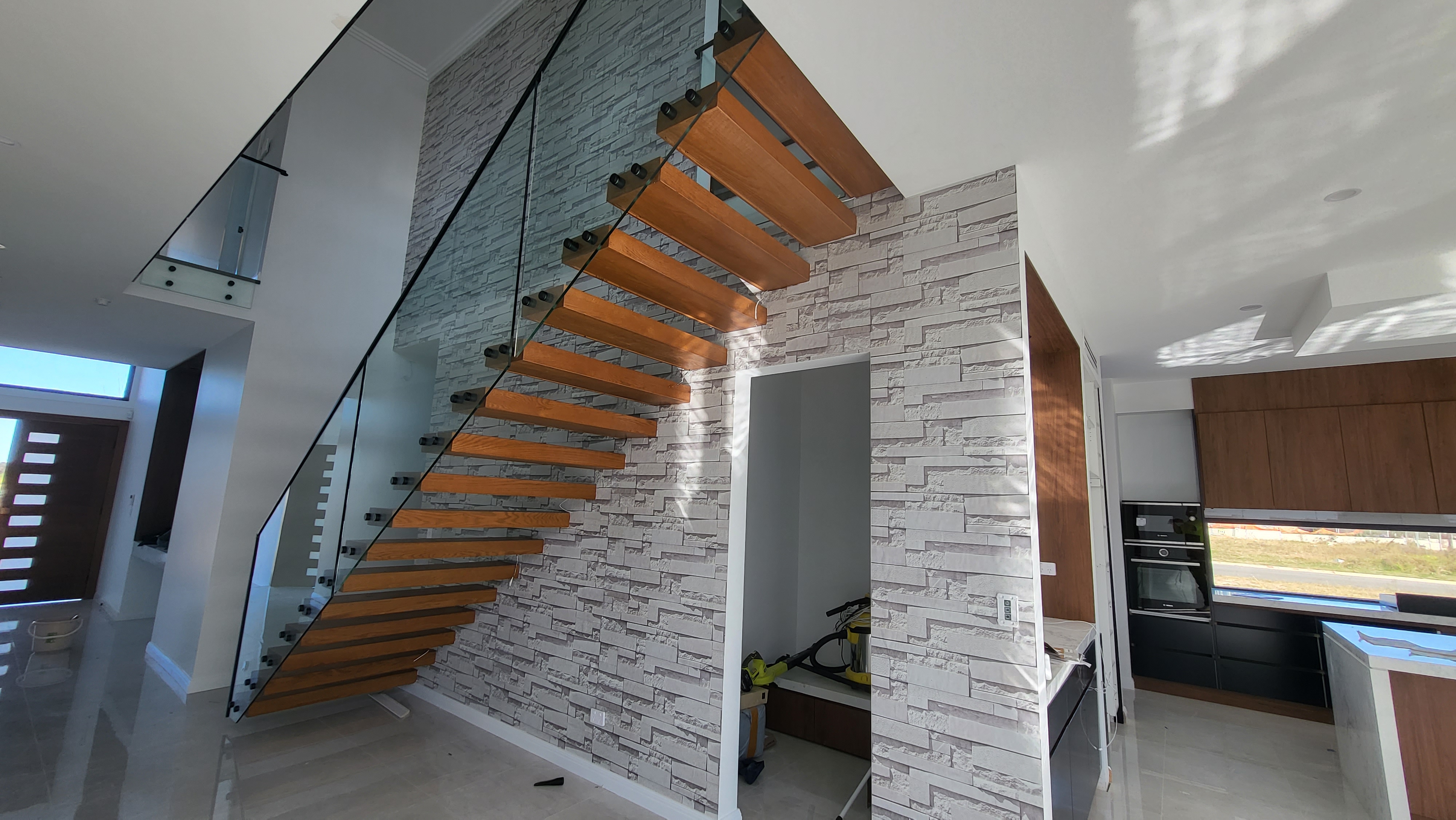 Staircase wallpaper installation by Wallpaper Masters